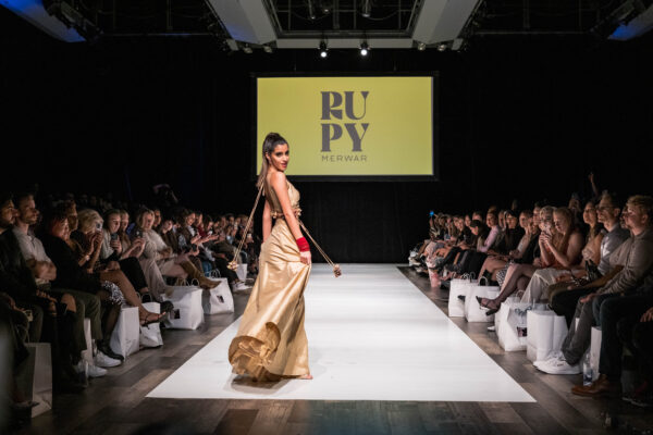 Girl on the Ramp Wearing Gold ruched Top